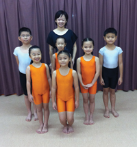 Alicia Lim Ai Hong with some of her eager pupils