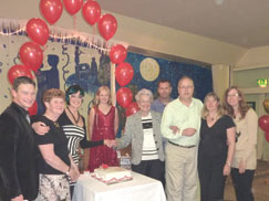 Peggy Spencer's birthday - cutting one of three cakes