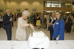 Dame Monica Mason cutting the celebratory cake, watched by Faculty Chair, Elisabeth Swan, former Chair, Mary-Jane Duckworth and Artistic Advisor, Richard Glasstone