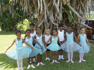Seychelles students take shelter from the hot sun after examinations