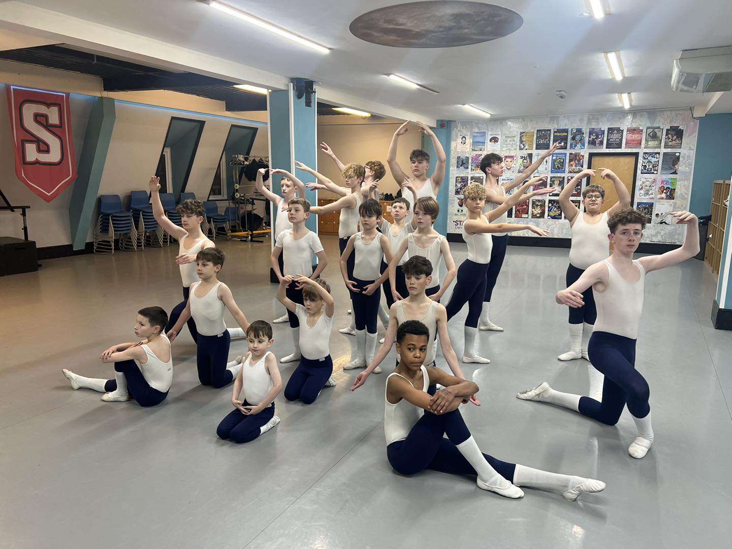 Twenty boys at The Starlight Dance and Musical Theatre School strike a pose in their ballet class