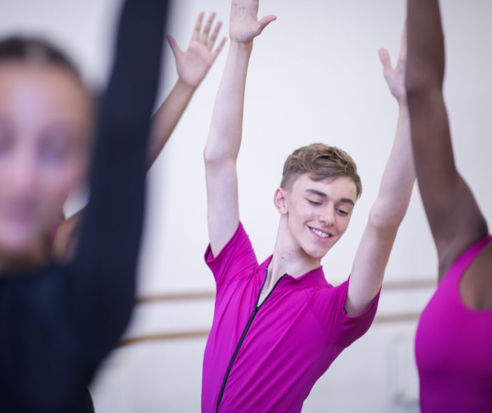 boy in pink uniform