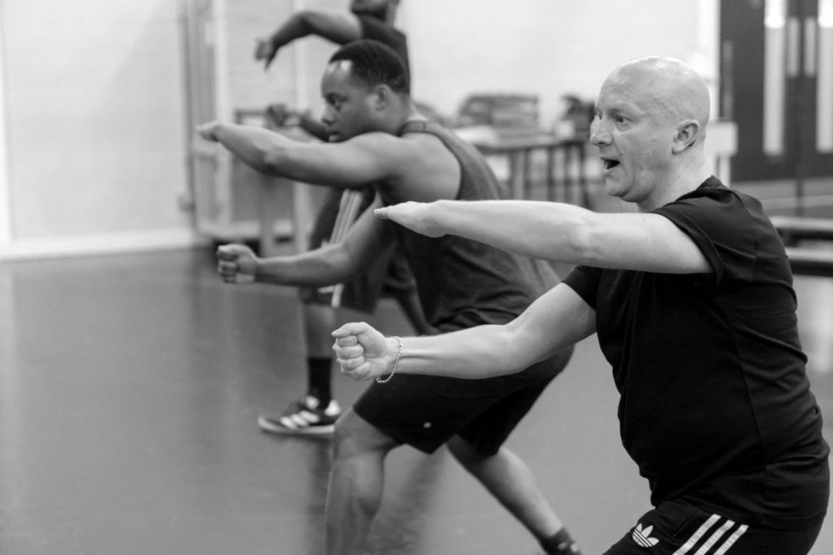 Mark Smith, Founder of Deaf Men Dancing, teaching dance to a student