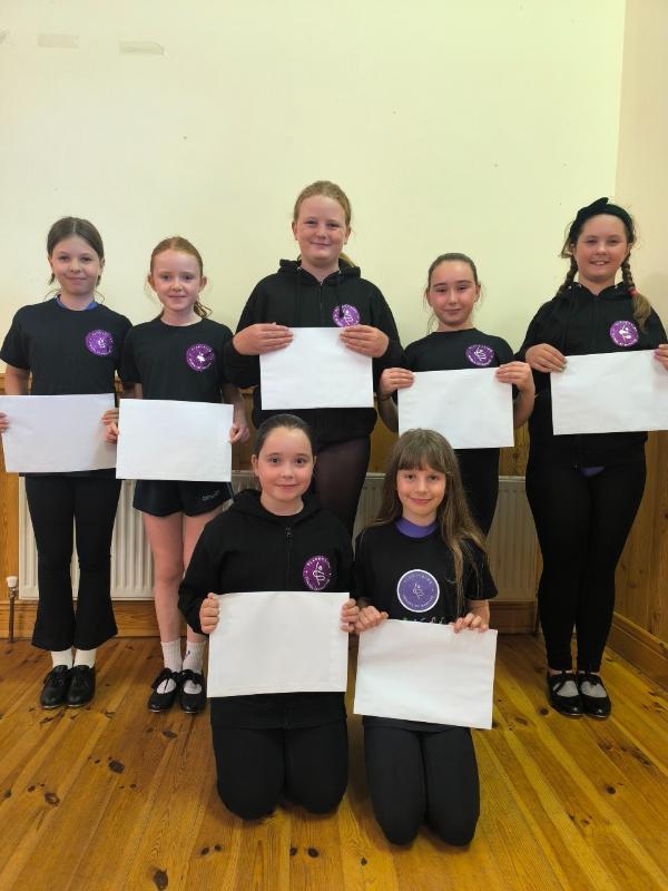 Samantha Murphy's students proudly displaying their certificates